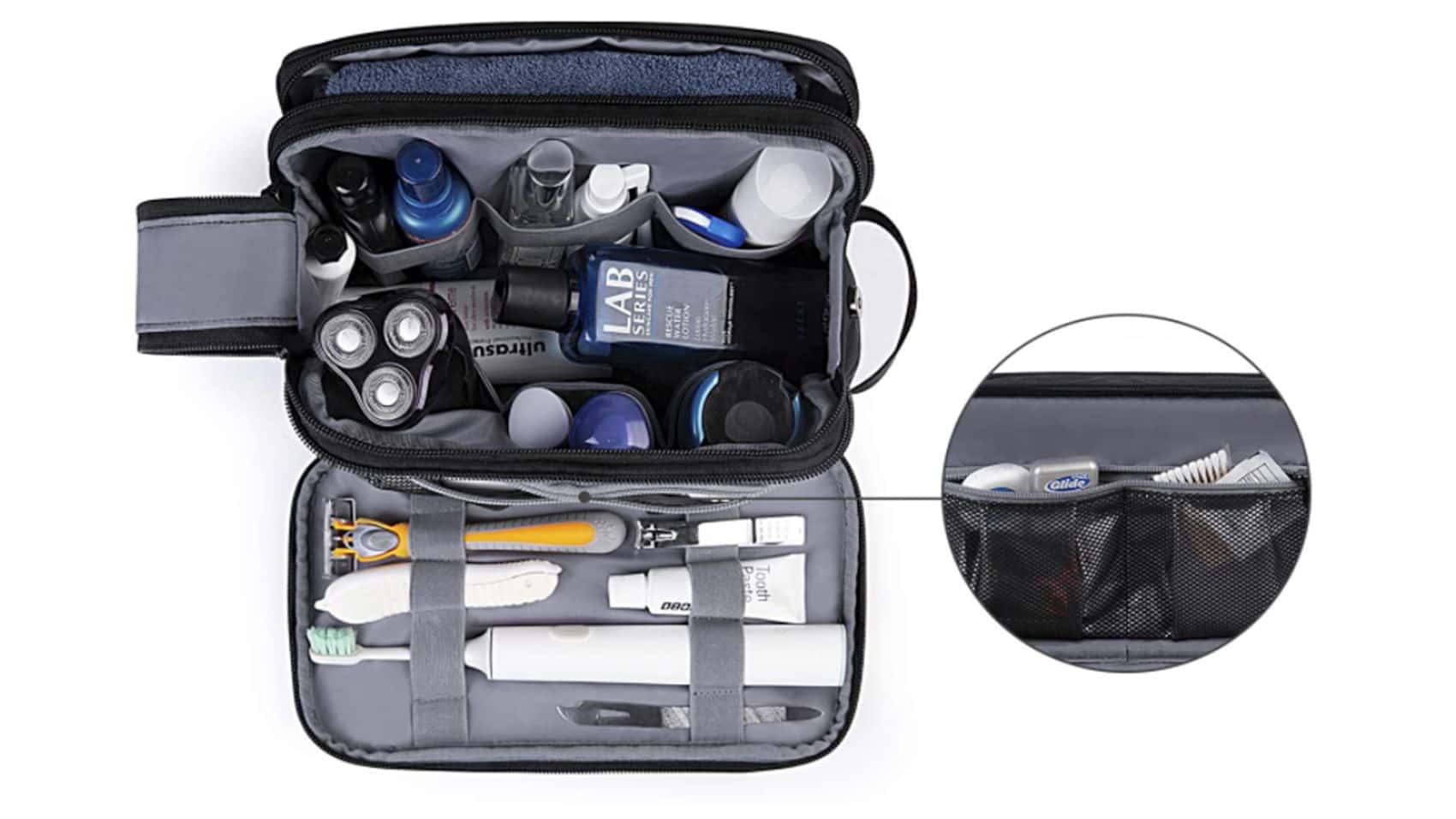 Open toiletry kit with elastic loops and mesh pockets holding travel toiletries