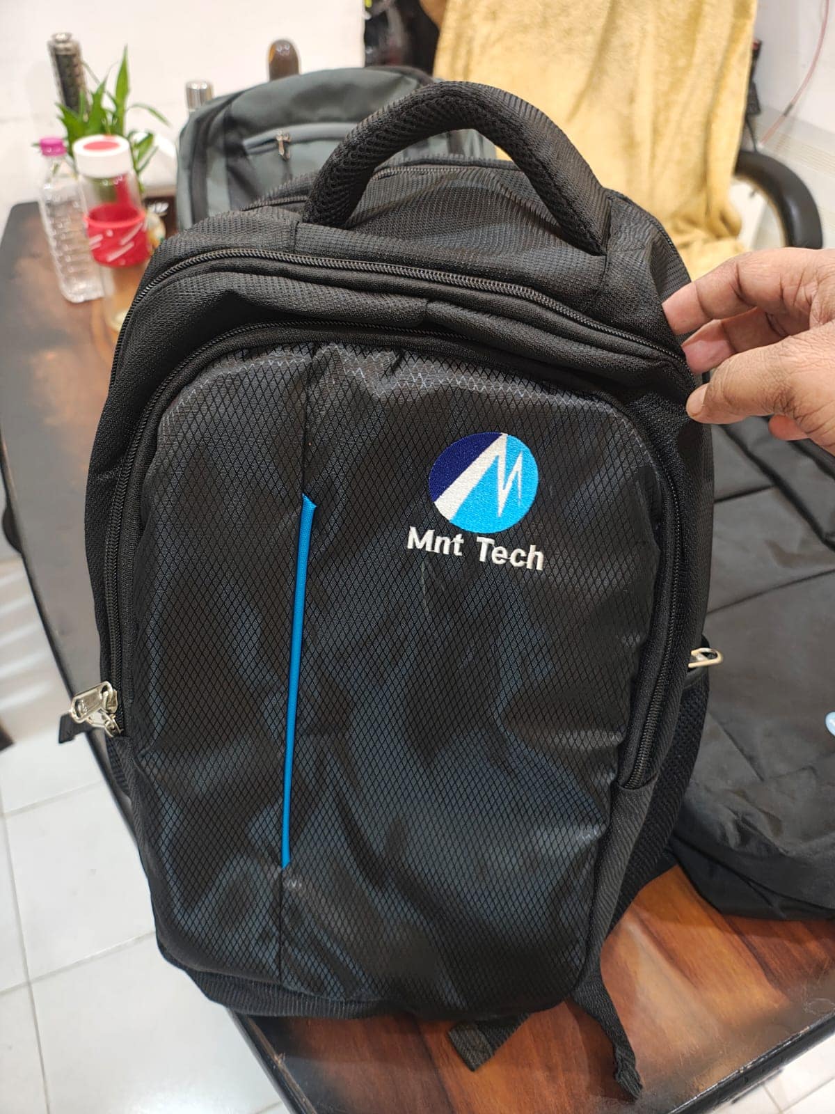 Laptop backpack embroidered with a customer's logo, made by ABM Bags in Hyderabad