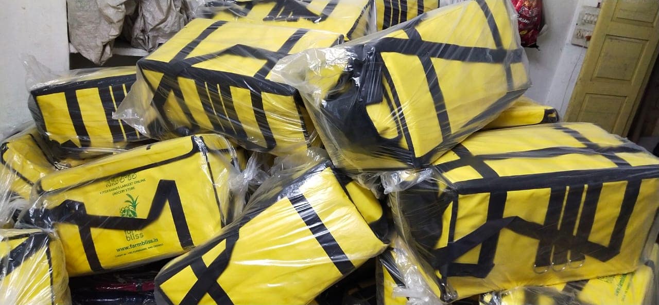 Branded insulated food delivery bags packed for dispatch at the ABM Bags unit in Hyderabad